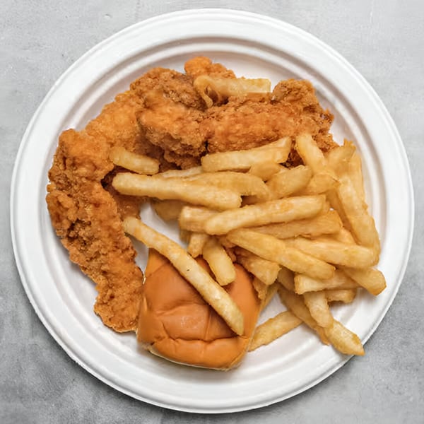 Chicken Holiday Takeout Shop's fried chicken tenders, french fries, and a bun on a white plate.